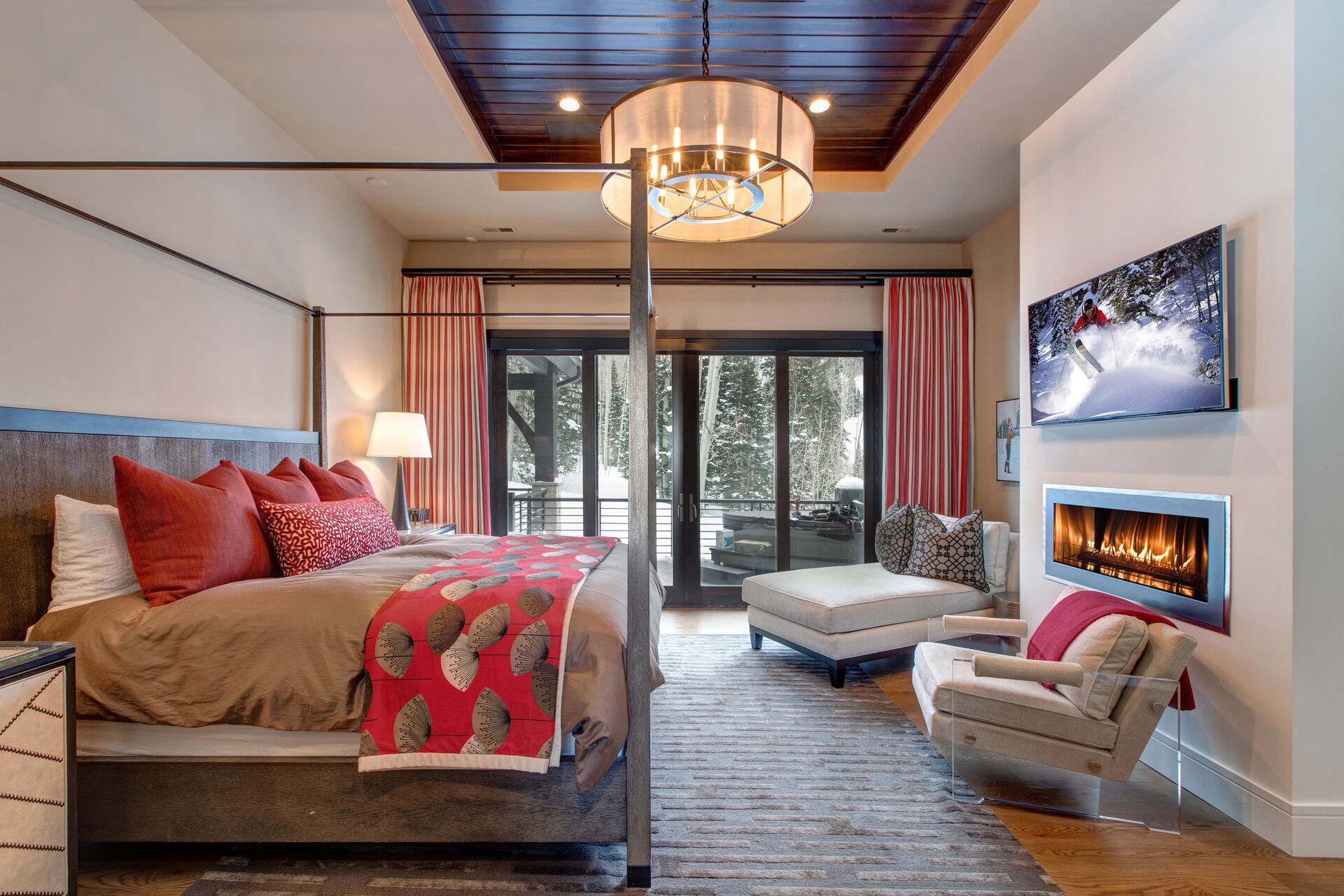 The Bedroom with Large Bed and a Fireplace of Our 6 Bedroom Vacation Homes in Park City, Utah.