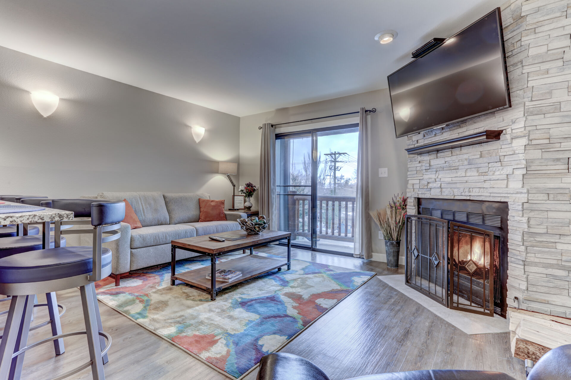 Living Room with TV and Fireplace of Our Condo Rentals in Park City.