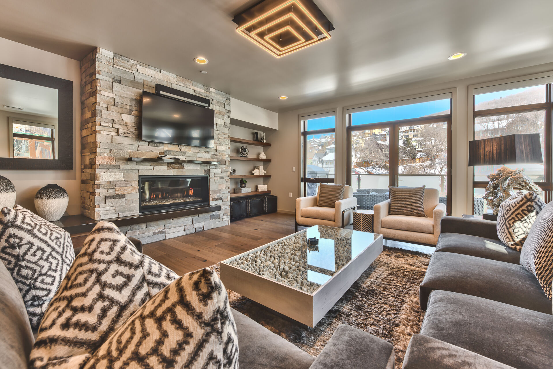 Living Room with TV and Fireplace in One of Our Condos for Rent in Park City, Utah.