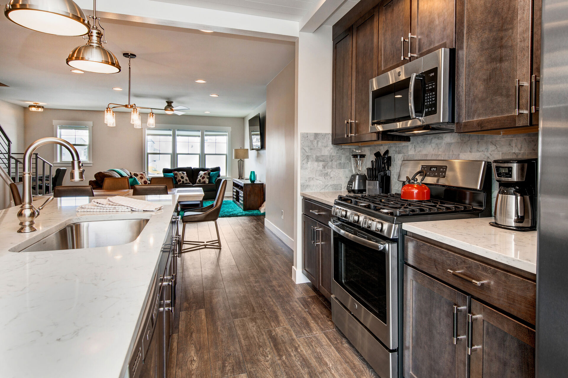 The Kitchen, Dining Space, and Living Area with a TV of Our Vacation Rentals in Park City.