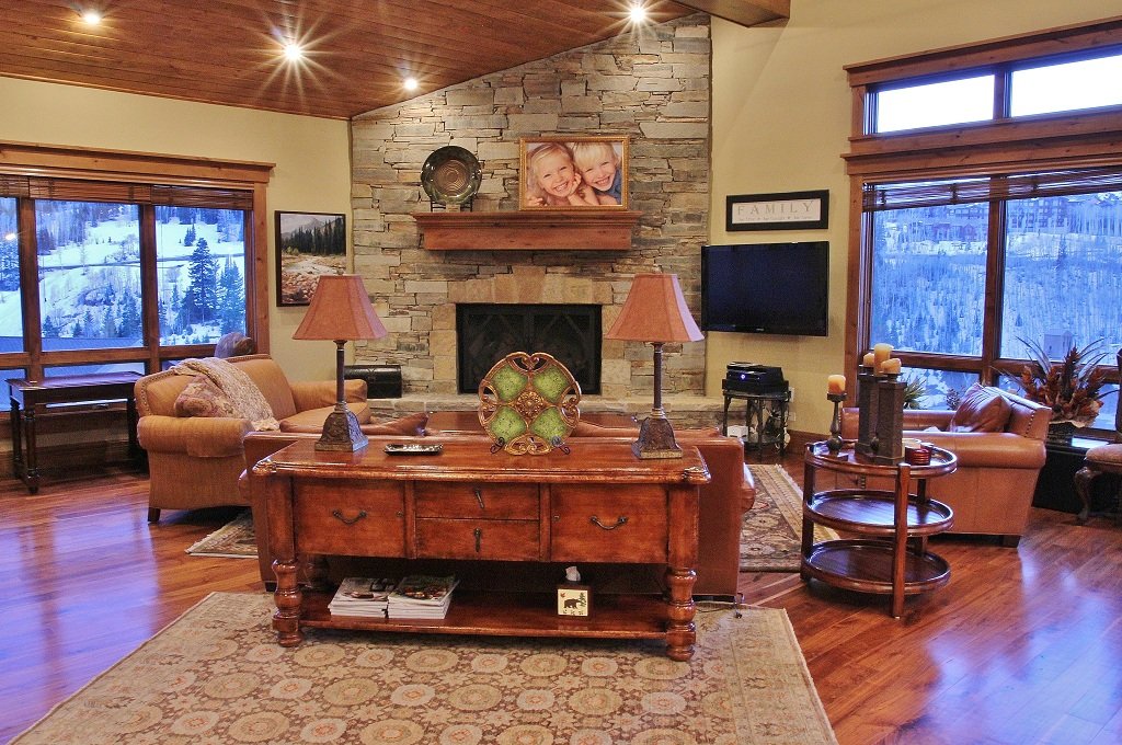 Mountain View Living Room with Fireplace and TV in Our Empire Pass Mansion Rentals.