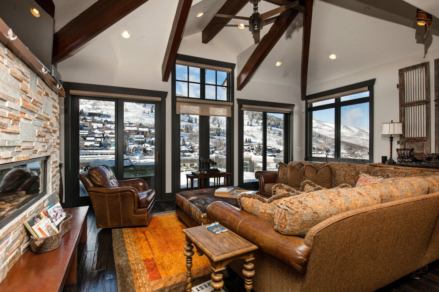 Living Room with Mountain Views and Fireplace in Our Lodging Ski In Ski Out.