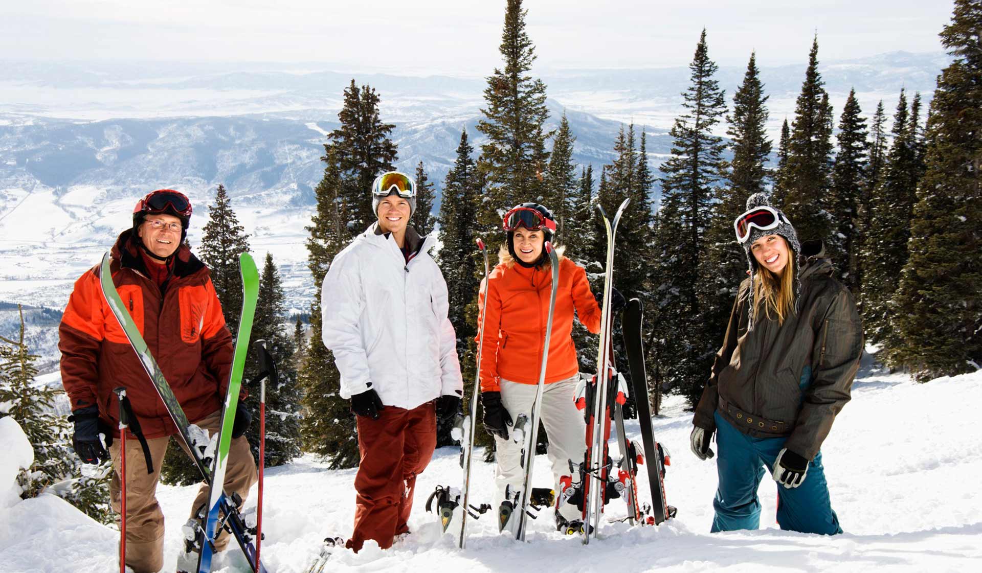 Skiers in the Mountains Surrounding our Vacation Rentals in Park City.
