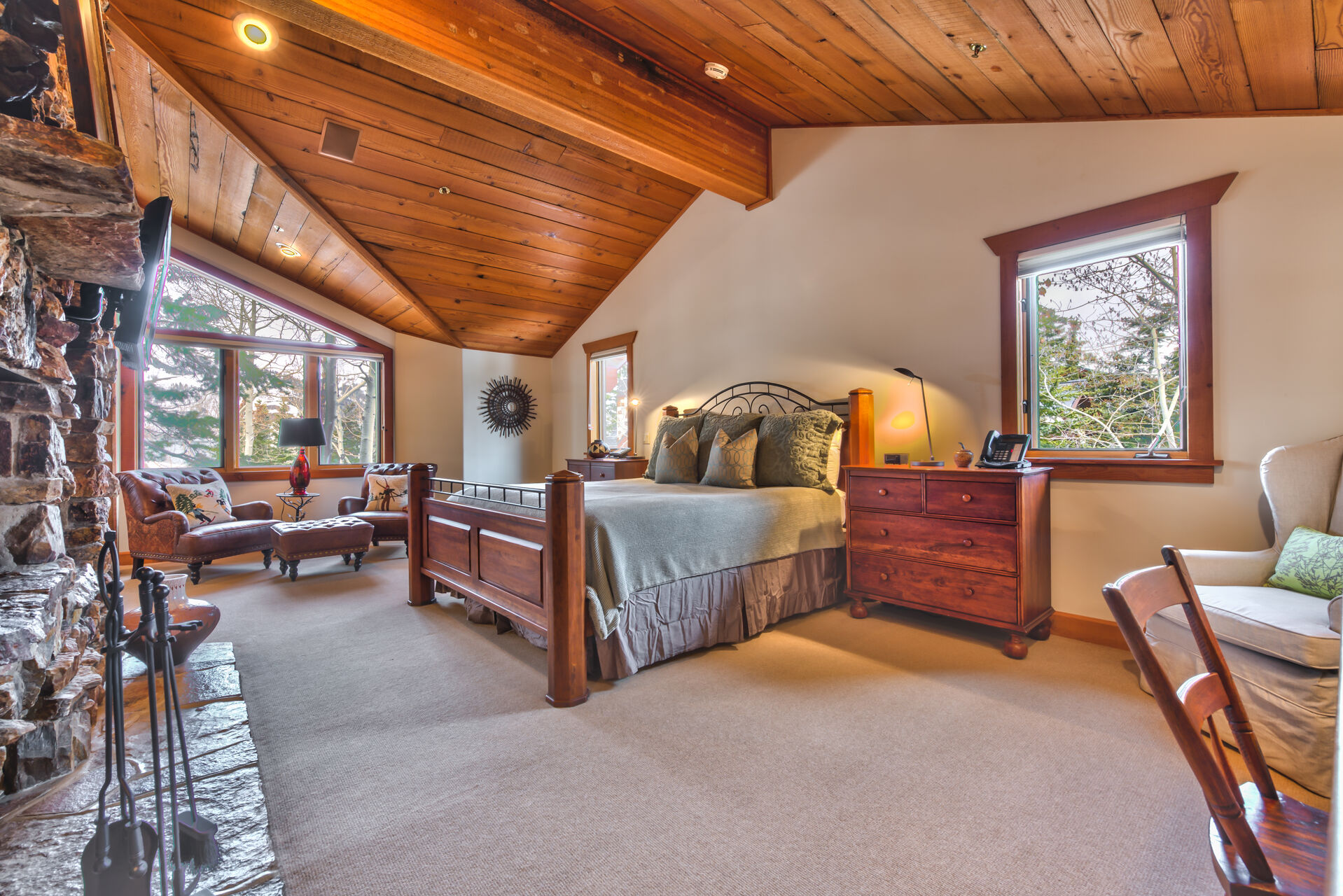 Bedroom with Large Bed, Fireplace, and Smart TV in Our Deer Valley Rental.