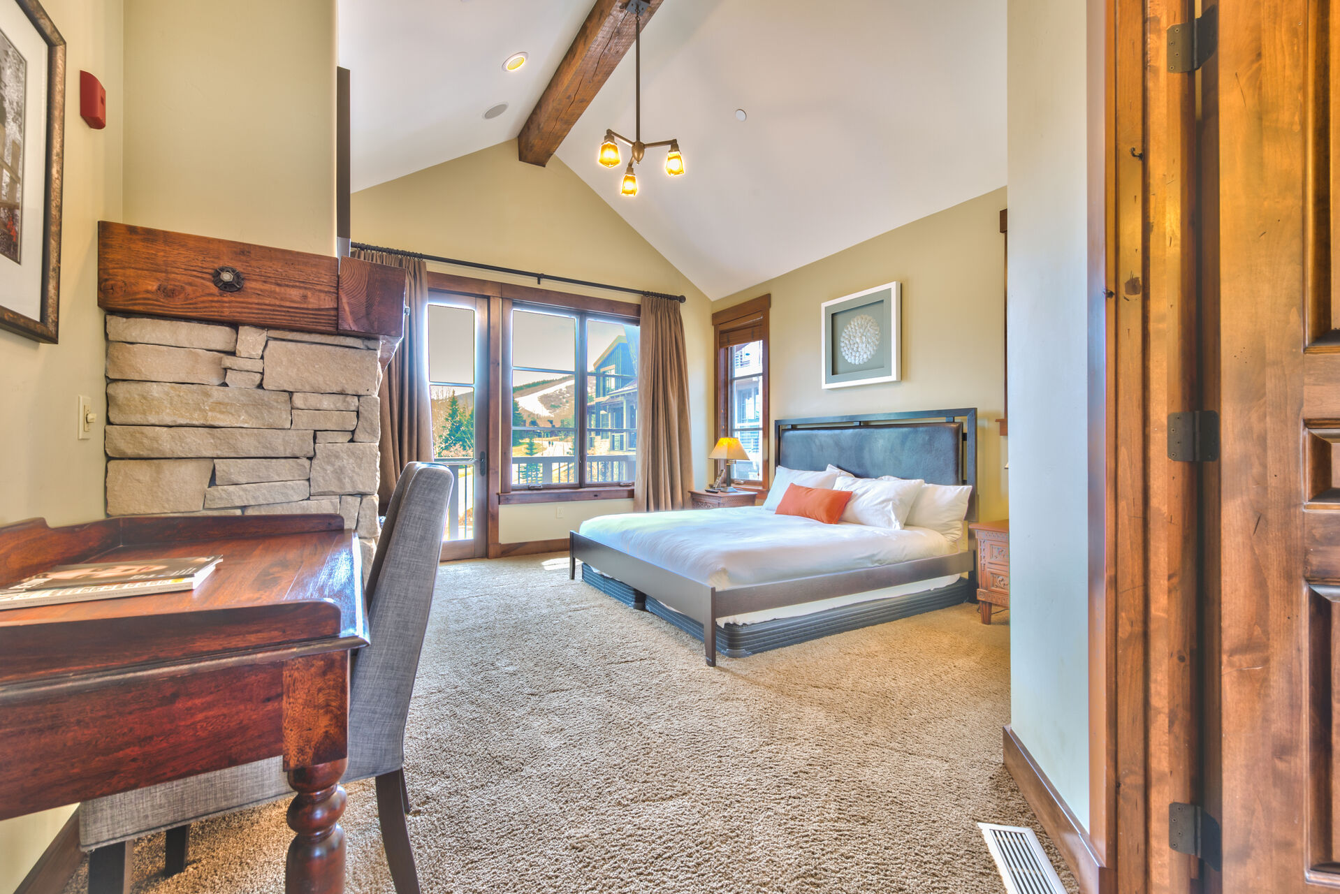 Large Bed and Desk in the Mountain View Bedroom in Our Park City Rentals.