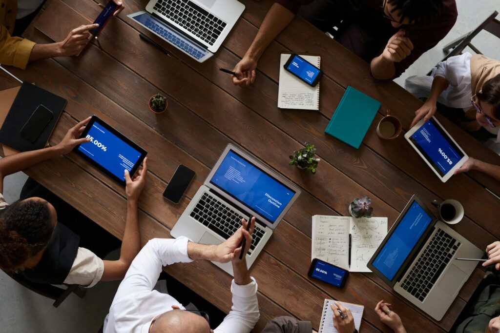 Group using laptops and tablets