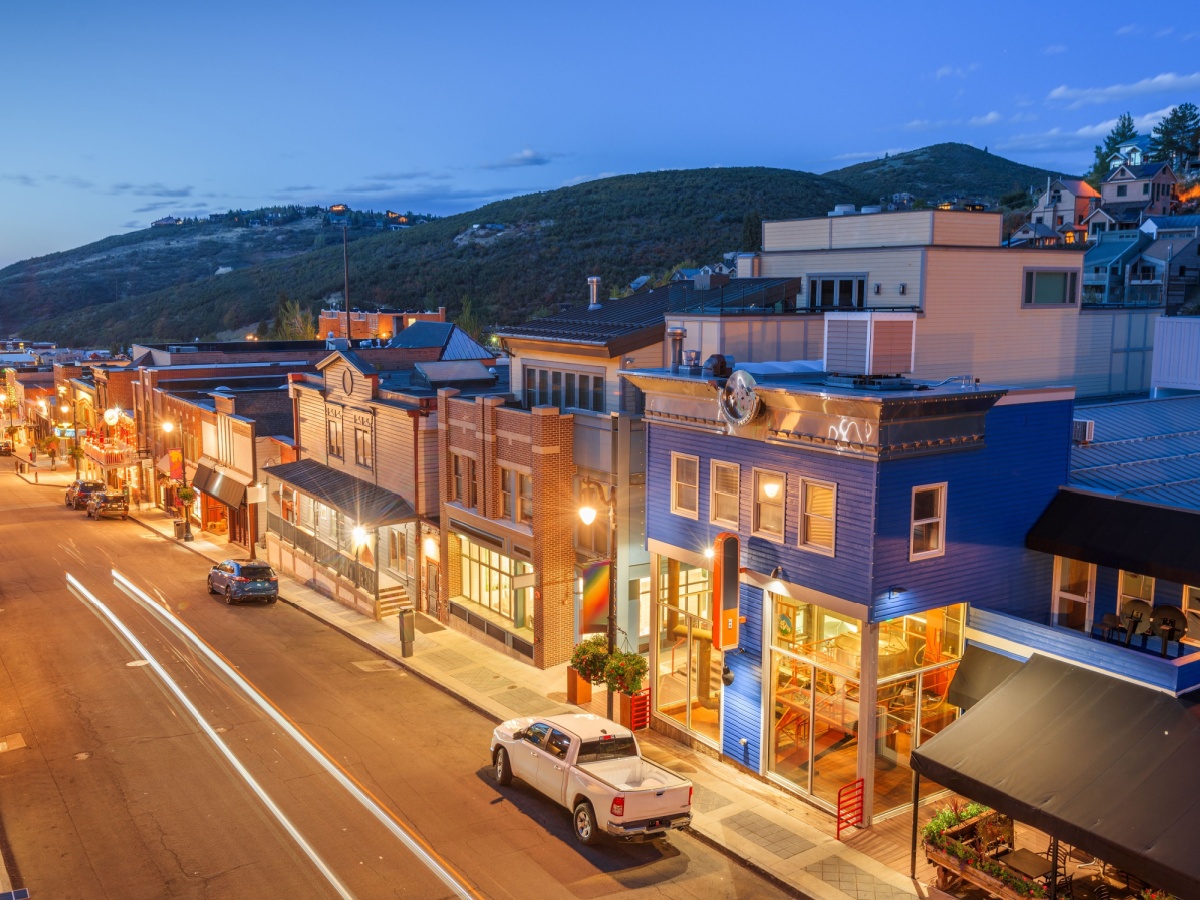 Main Street in Park City Utah at dusk with lighted streets.